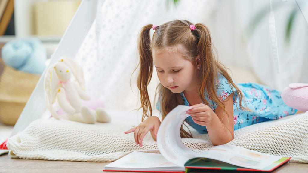 a kid reading a book